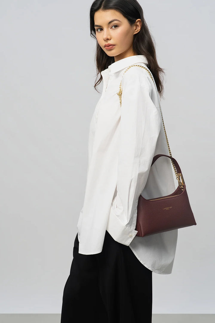 Sac à main en cuir bordeaux et bandoulière chaine dorée Lancaster Lyche Ace 422-038